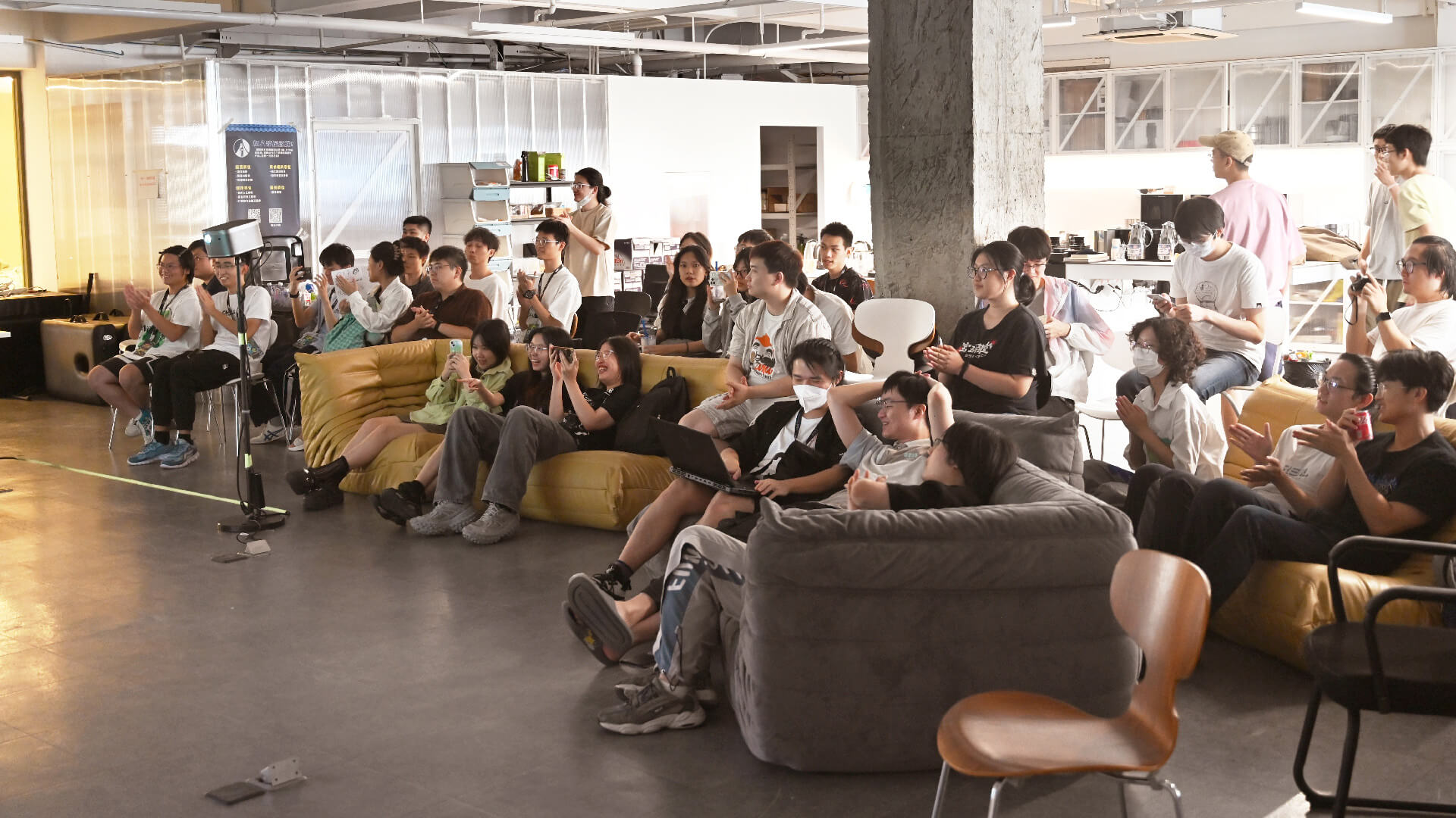 Collaborative development: Developers sitting together in ChillyRoom’s office, listening to the showcase of each other’s game project